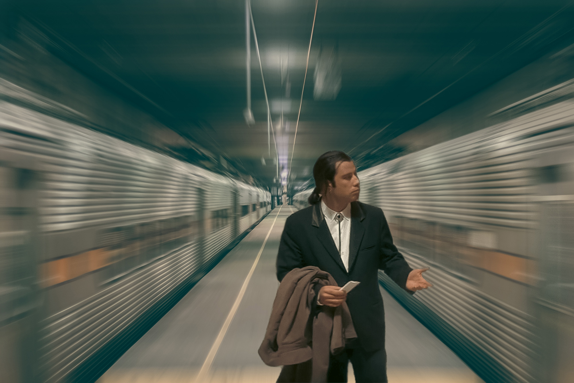 Confused Travolta between Speedy Trains