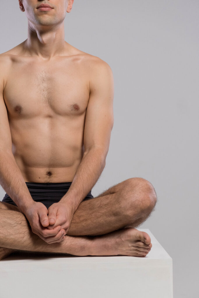 Man sitting in yoga pose