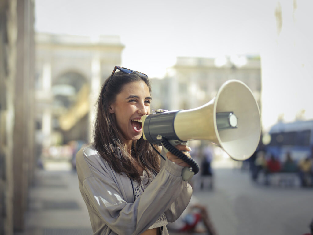 Woman screaming into megaphone