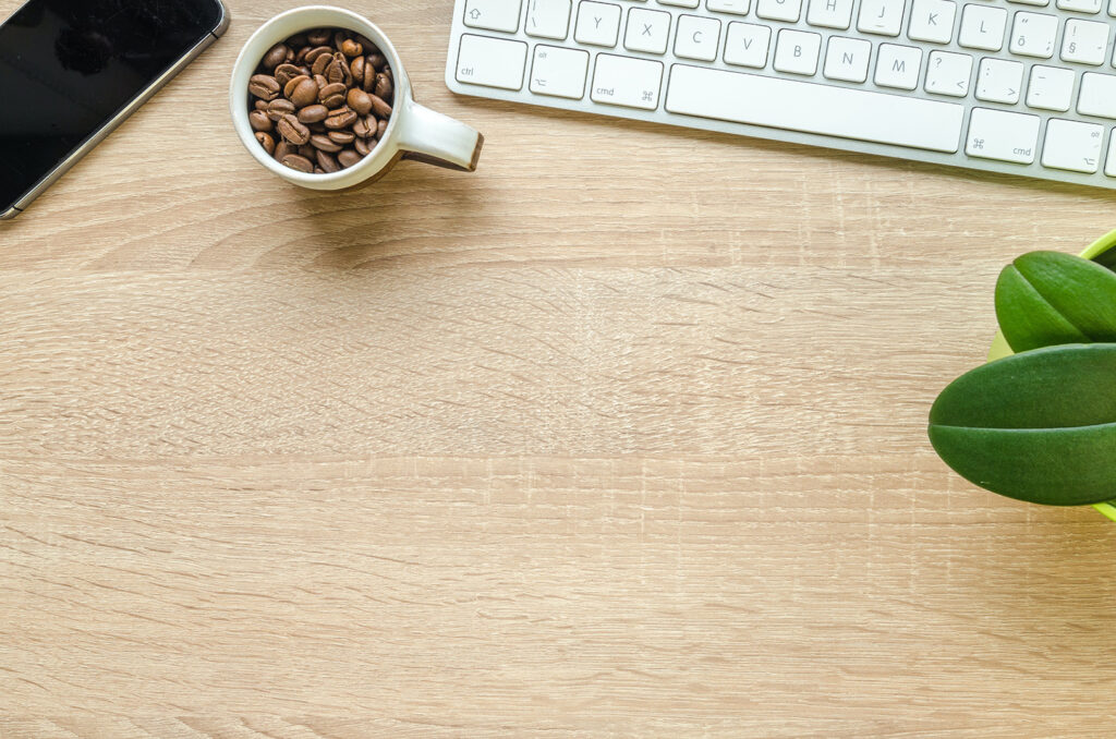 Table with keyboard and coffee beans