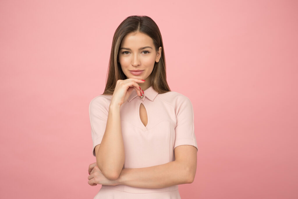 Young Smiling Woman in Pink